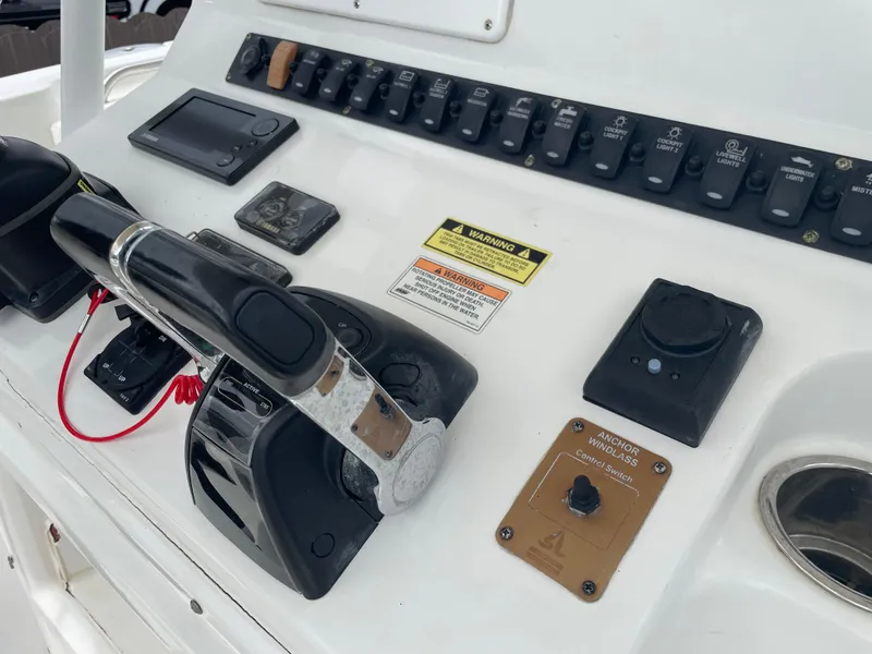 Slide: The Image of Control panel of 2011 Sea Hunt Gamefish 29 boat with switches and throttle. - 20