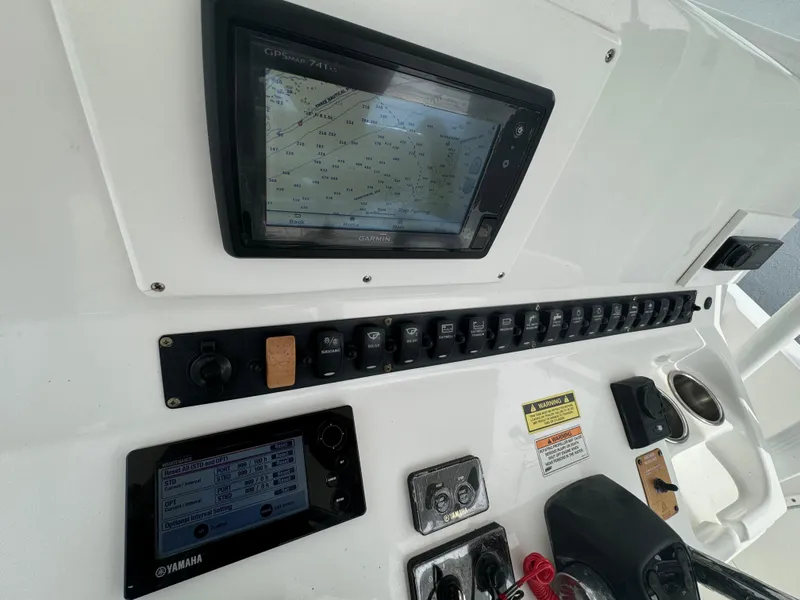 Slide: The Image of 2011 Sea Hunt Gamefish 29 dashboard with navigation and control panels. - 22