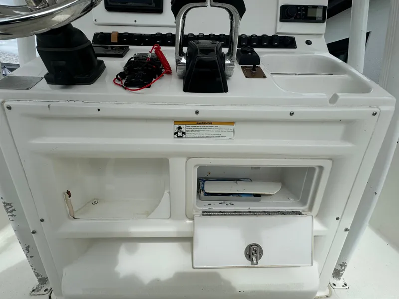 Slide: The Image of 2011 Sea Hunt Gamefish 29 console with storage compartments and controls. - 25