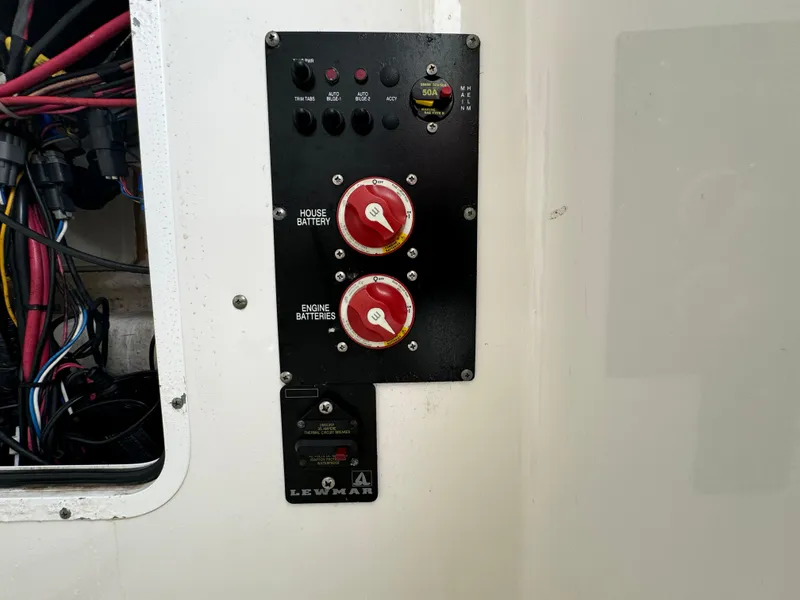 Slide: The Image of Control panel on a 2011 Sea Hunt Gamefish 29 boat with battery switches. - 29