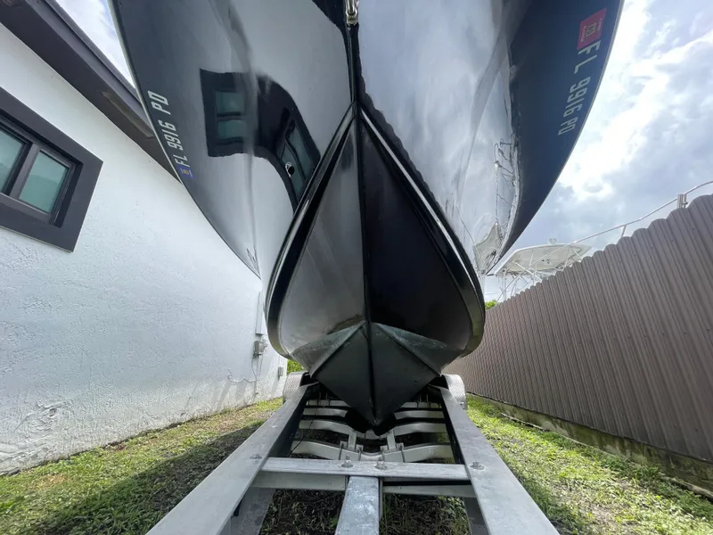 Slide: The Image of 2011 Sea Hunt Gamefish 29 boat on trailer, viewed from below. - 3