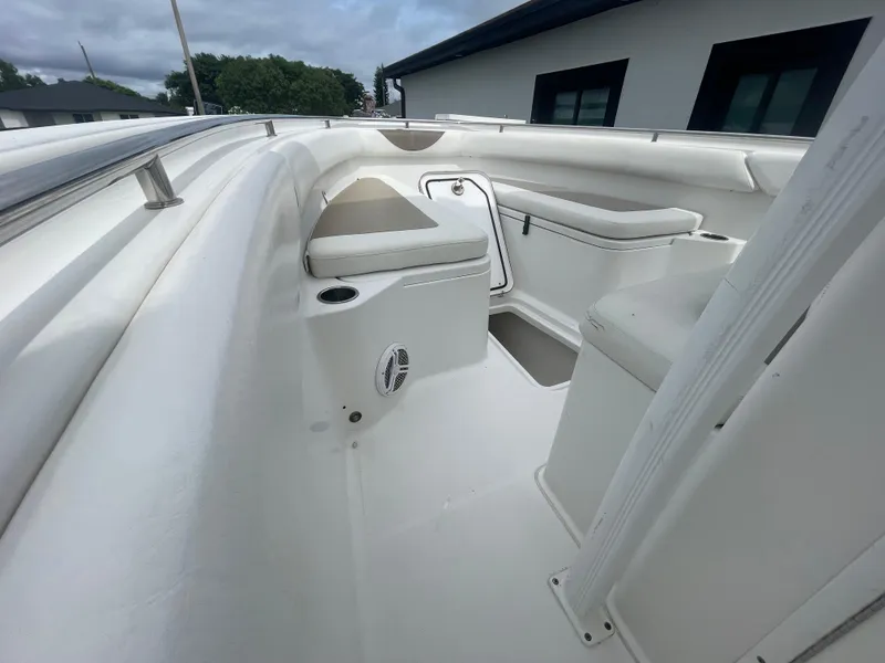 Slide: The Image of 2011 Sea Hunt Gamefish 29 boat interior with seating and storage compartments. - 30