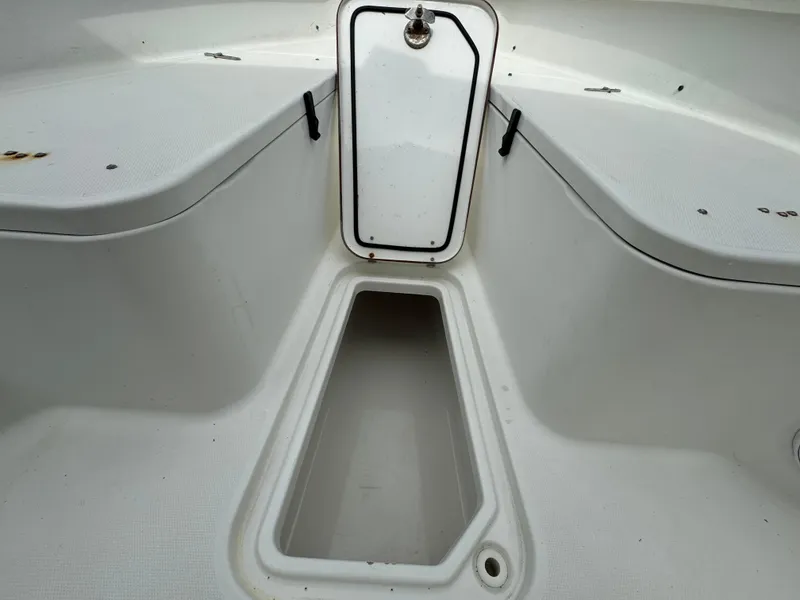 Slide: The Image of 2011 Sea Hunt Gamefish 29 boat storage compartment, open and empty. - 33