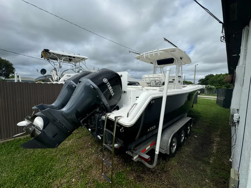 Slide: The Image of 2011 Sea Hunt Gamefish 29 boat with Yamaha outboard engines on trailer. - 4