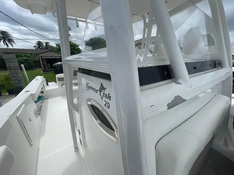 Slide: The Image of 2011 Sea Hunt Gamefish 29 boat, white interior, outdoor setting. - 41