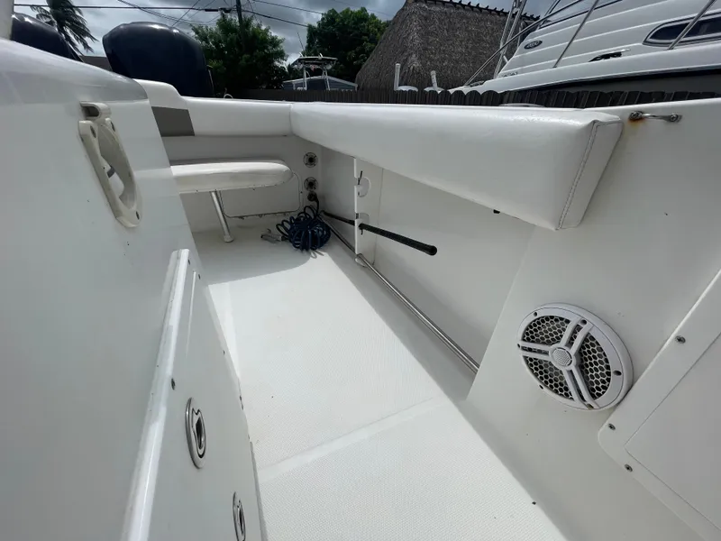Slide: The Image of 2011 Sea Hunt Gamefish 29 boat interior with seating and speaker. - 42