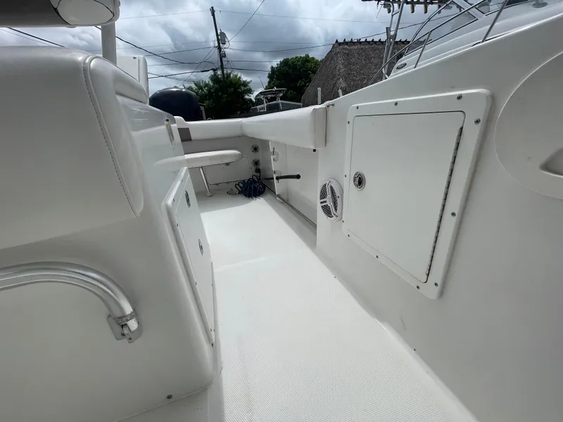 Slide: The Image of 2011 Sea Hunt Gamefish 29 boat interior with storage compartments and clean deck. - 43