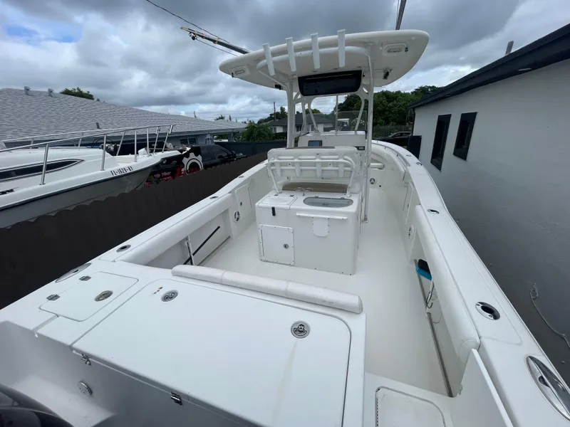 Slide: The Image of 2011 Sea Hunt Gamefish 29 boat with spacious deck and modern console. - 46