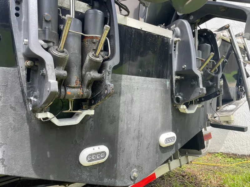 Slide: The Image of 2011 Sea Hunt Gamefish 29 boat transom with hydraulic components and underwater lights. - 8