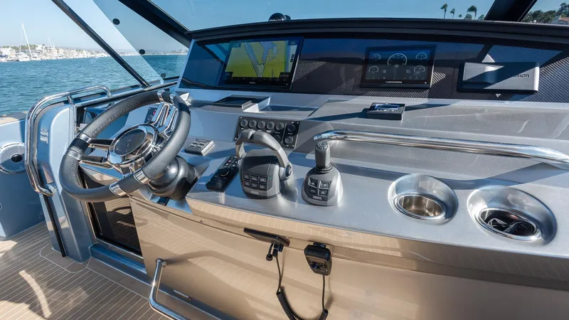 Slide: The Image of Helm of 2022 Pardo Yachts 43 with modern navigation equipment and controls. - 19