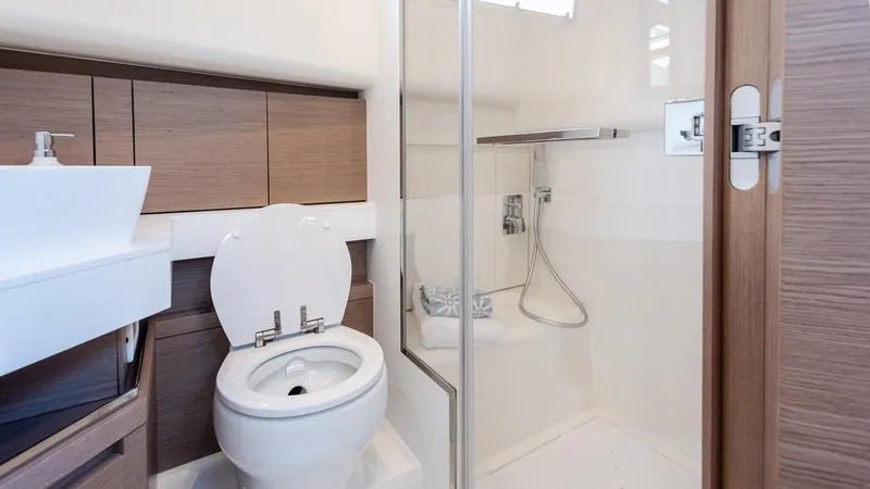 Slide: The Image of Modern bathroom in 2022 Pardo Yachts 43, featuring sleek design and wood accents. - 26
