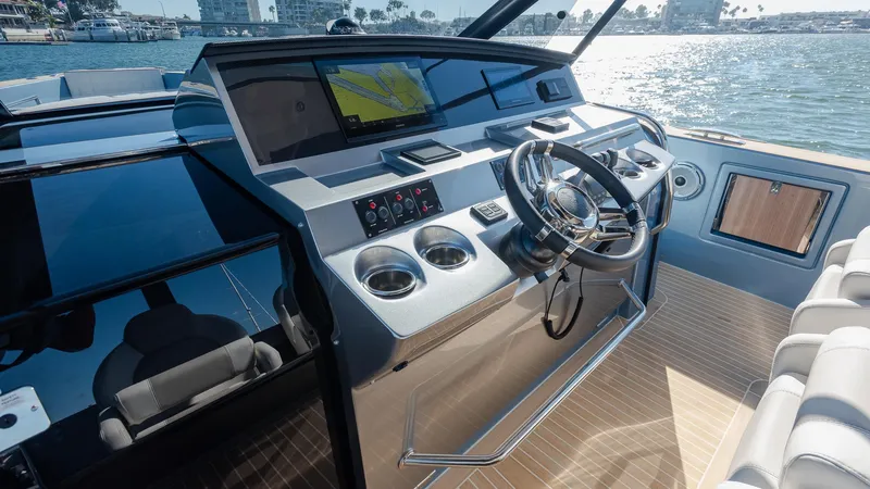Slide: The Image of 2022 Pardo Yachts 43 helm with modern controls and waterfront view. - 20