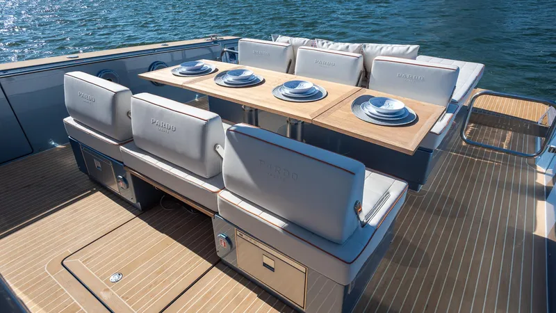 Slide: The Image of Luxurious 2022 Pardo Yachts 43 with elegant dining setup on deck. - 12
