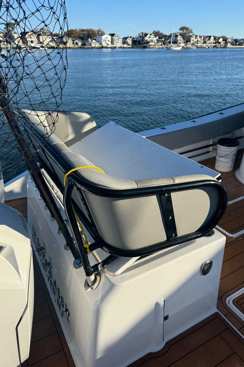 Slide: The Image of 2023 Cape Horn 39T boat with fishing gear, docked by a scenic waterfront. - 8