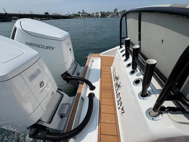 Slide: The Image of 2023 Cape Horn 39T boat with dual Mercury engines on a calm waterway. - 24