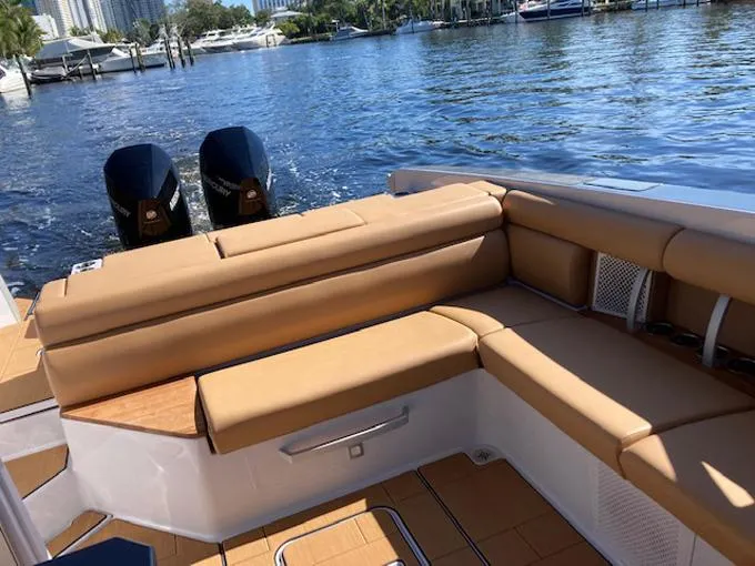 Slide: The Image of Luxury seating on 2022 Aviara AV32 OB boat with scenic waterfront view. - 12