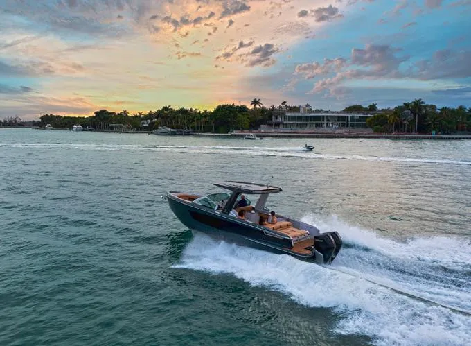 Slide: The Image of Aviara AV32 OB 2022 cruising on scenic water at sunset. - 19