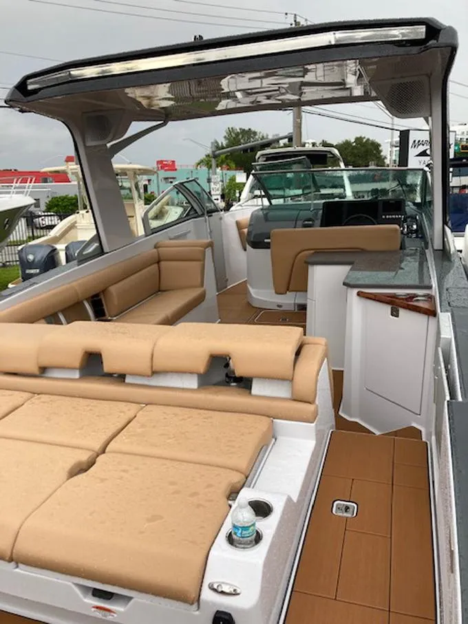 Slide: The Image of 2022 Aviara AV32 OB luxury boat with tan seating and sleek design. - 8