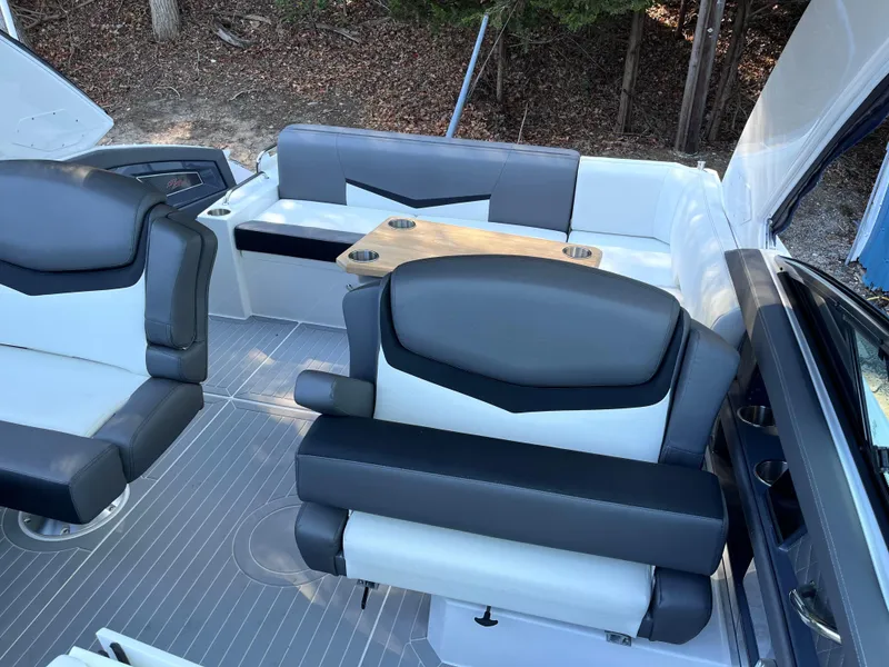 Slide: The Image of 2021 Cruisers Yachts 338 CX IO interior with sleek seating and modern design. - 5