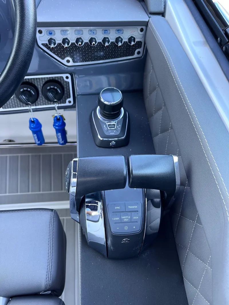 Slide: The Image of 2021 Cruisers Yachts 338 CX IO helm controls and dashboard detail. - 9