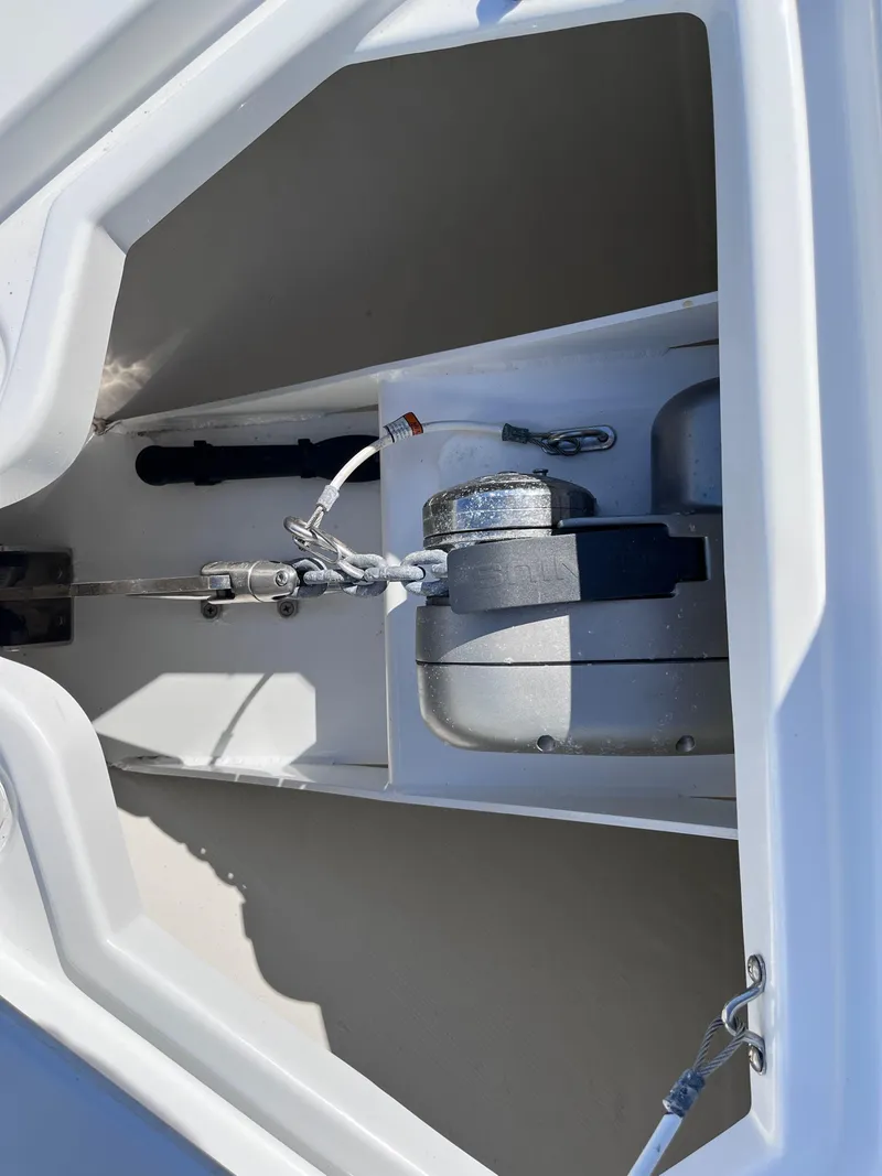Slide: The Image of 2021 Cruisers Yachts 338 CX IO anchor compartment with winch system. - 17
