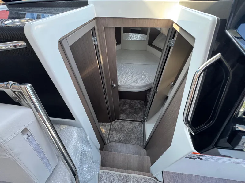 Slide: The Image of Interior cabin view of 2025 Jeanneau NC 895 Series 2 boat, featuring modern design and cozy sleeping area. - 17