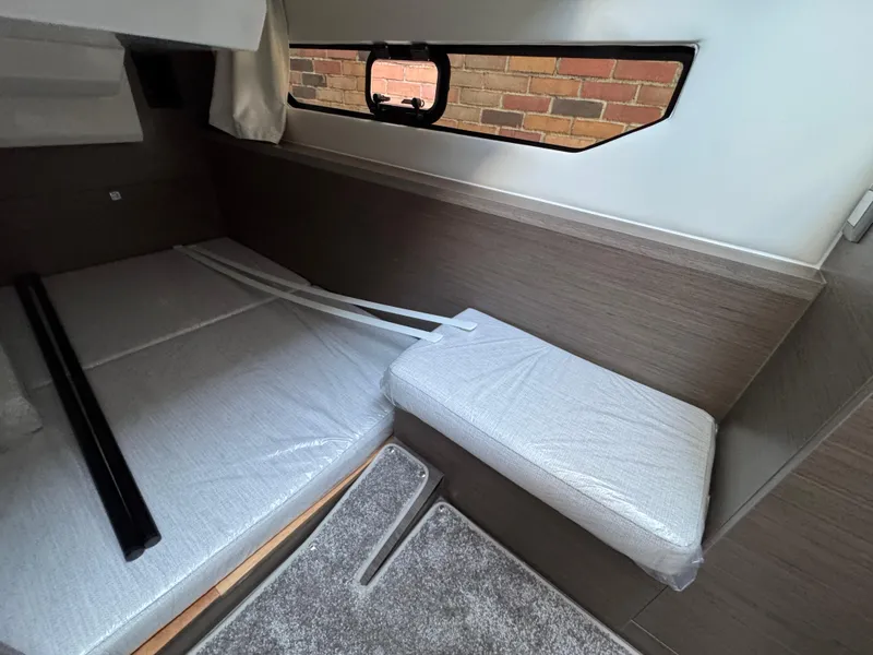 Slide: The Image of Interior cabin of 2025 Jeanneau NC 895 Series 2 with modern design and window view. - 27