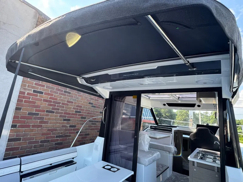 Slide: The Image of 2025 Jeanneau NC 895 Series 2 boat interior with modern design and spacious seating. - 3