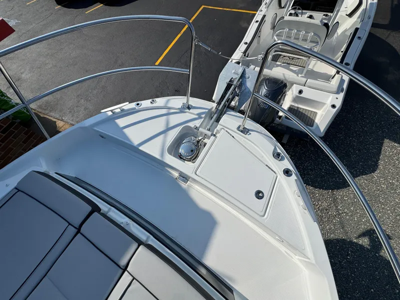 Slide: The Image of 2025 Jeanneau NC 895 Series 2 boat deck with railing and seating area. - 31