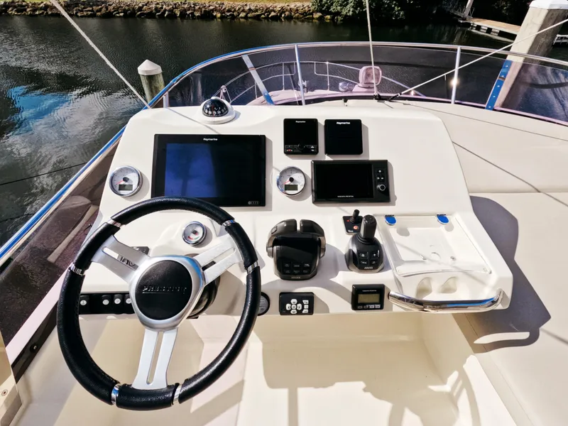 Slide: The Image of Prestige 460 yacht helm with modern navigation controls, 2020 model. - 11
