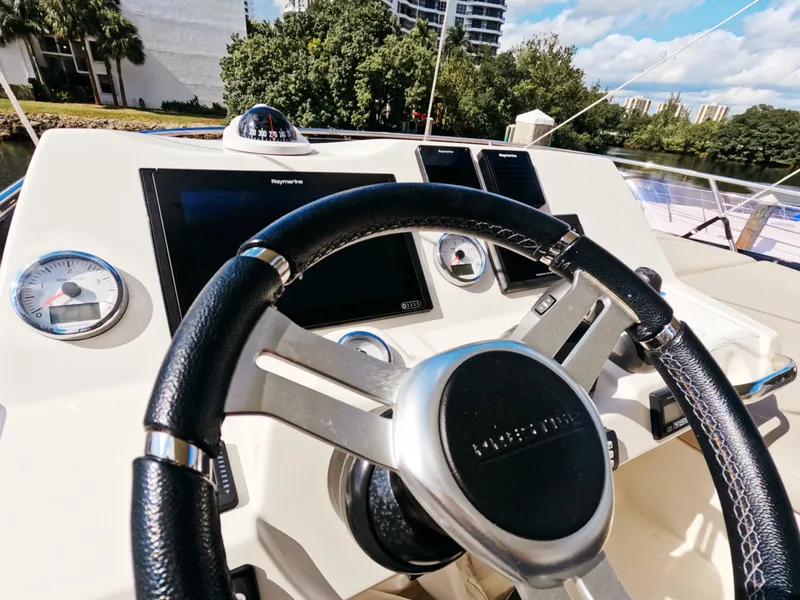 Slide: The Image of Prestige 460 yacht helm with modern navigation equipment, 2020 model. - 12