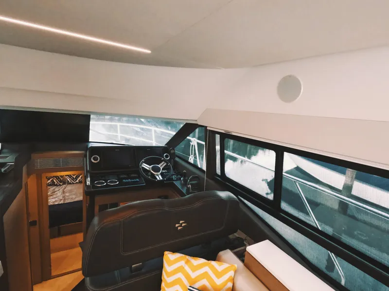Slide: The Image of Interior of 2020 Prestige 460 yacht, featuring helm station and modern design elements. - 26