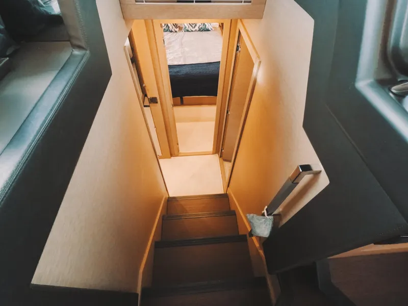 Slide: The Image of Interior staircase of 2020 Prestige 460 yacht, leading to lower cabin area. - 29