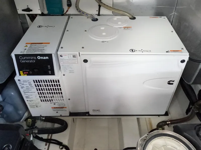 Slide: The Image of Cummins Onan generator in a 2020 Prestige 460 yacht engine room. - 44
