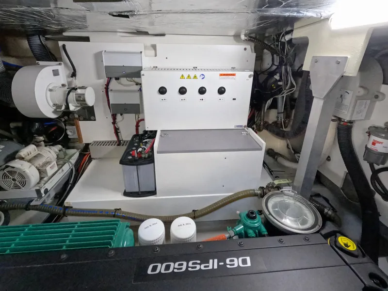 Slide: The Image of Engine room of 2020 Prestige 460 yacht with mechanical components and control panel. - 45