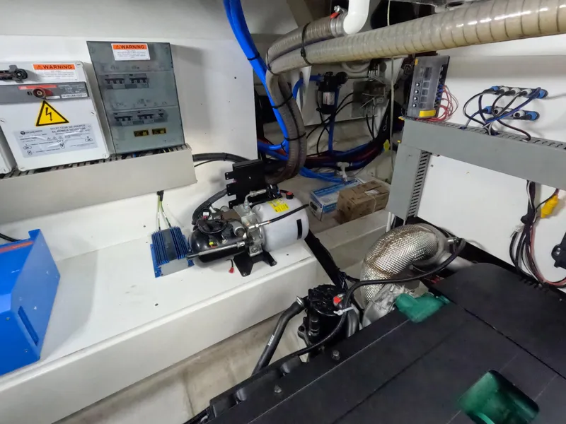 Slide: The Image of Engine room of 2020 Prestige 460 yacht with electrical panels and machinery. - 47