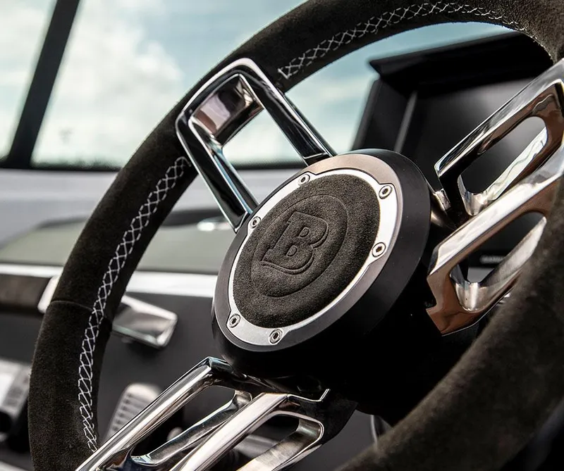Slide: The Image of Close-up of 2024 Axopar 37 XC BRABUS steering wheel with luxury detailing. - 10