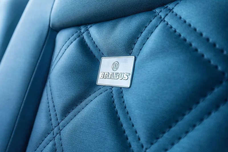 Slide: The Image of Close-up of 2024 Axopar 37 XC BRABUS Trim Wet Bar seat with BRABUS logo. - 21