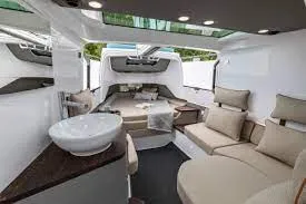 Slide: The Image of Luxurious interior of 2024 Axopar 37 XC BRABUS with wet bar and seating area. - 23