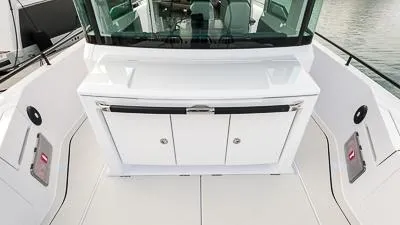 Slide: The Image of 2024 Axopar 37 XC BRABUS Trim Wet Bar, sleek design, modern amenities. - 5