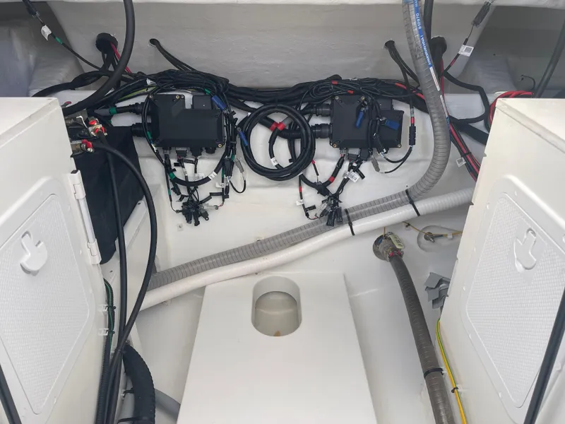 Slide: The Image of Engine compartment of 2024 Beneteau Gran Turismo 32, showcasing wiring and components. - 16
