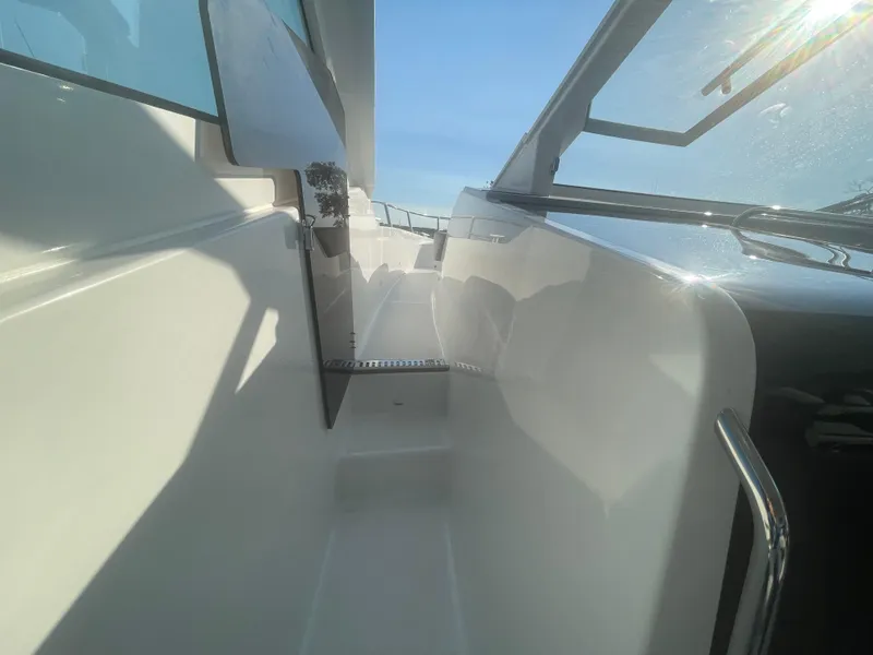 Slide: The Image of 2024 Beneteau Gran Turismo 32 yacht deck with sleek design and open windows. - 19