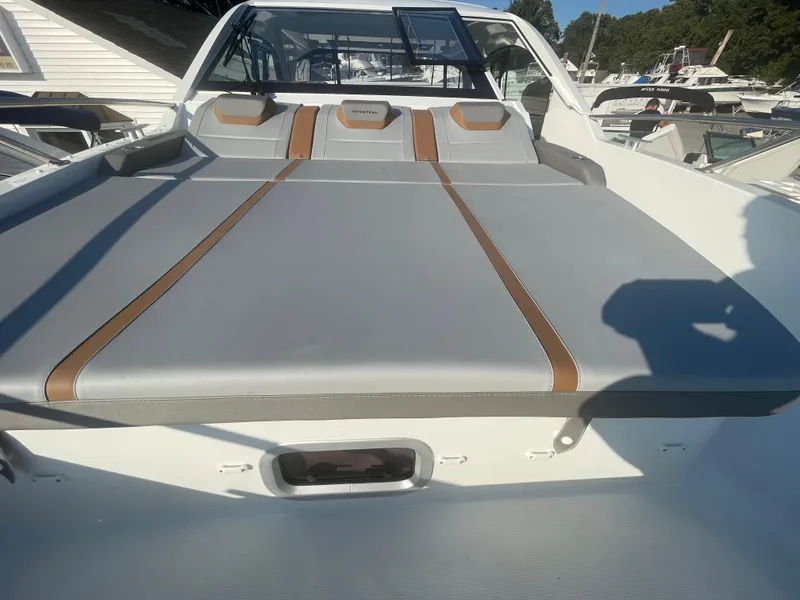 Slide: The Image of 2024 Beneteau Gran Turismo 32 boat with sleek gray and brown seating. - 20