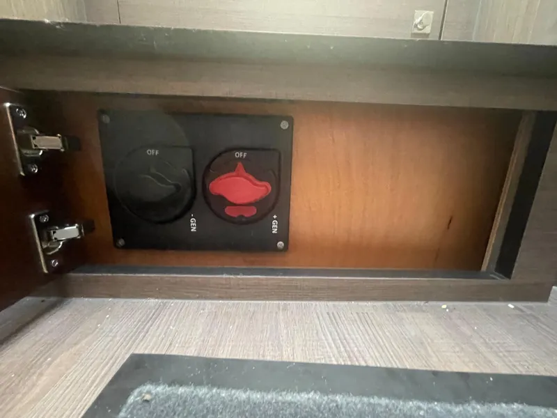 Slide: The Image of Control panel inside 2024 Beneteau Gran Turismo 32 yacht, featuring switches for electrical systems. - 29