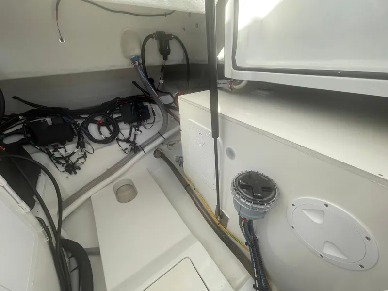 Slide: The Image of 2024 Beneteau Gran Turismo 32 engine compartment with wiring and components. - 30