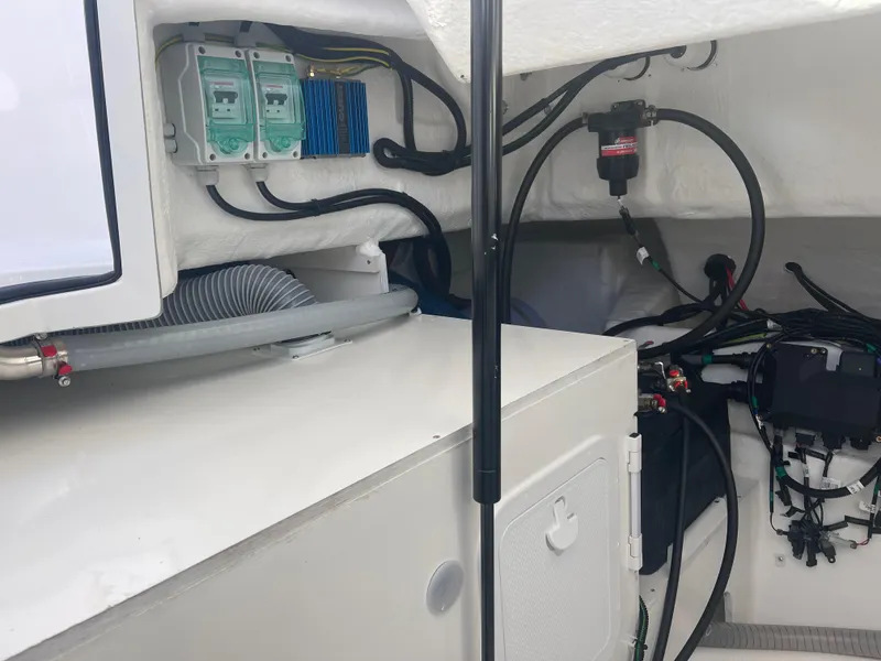 Slide: The Image of 2024 Beneteau Gran Turismo 32 engine compartment showcasing wiring and components. - 31