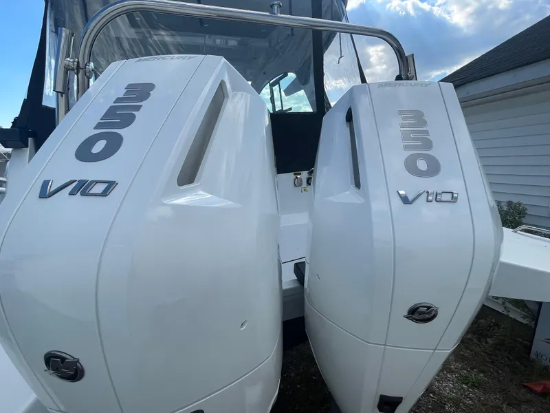Slide: The Image of 2024 Beneteau Gran Turismo 32 with twin 350 V10 outboard engines, rear view. - 35