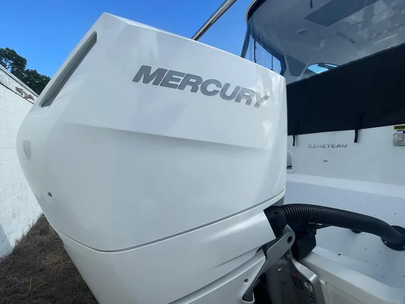 Slide: The Image of 2024 Beneteau Gran Turismo 32 with Mercury outboard engine, close-up view. - 37