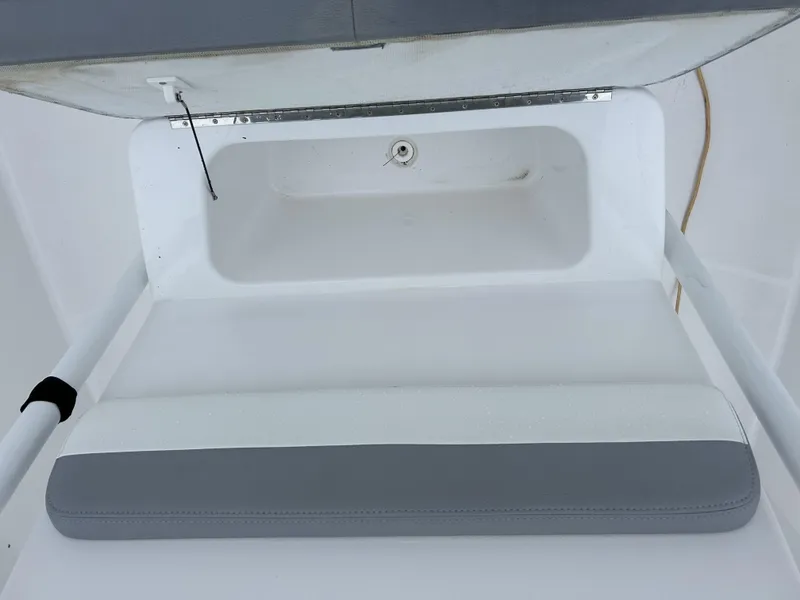 Slide: The Image of 2021 Release 240RX boat interior with white and gray seating. - 14