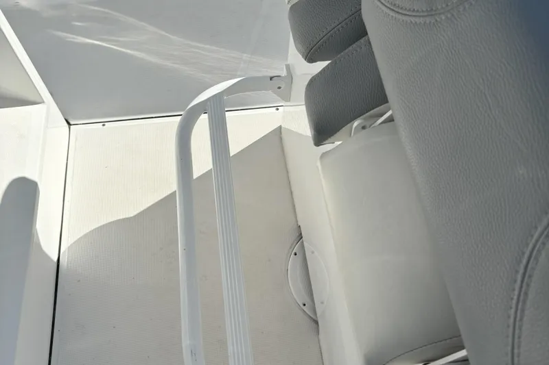 Slide: The Image of Interior of 2021 Release 240RX boat with gray seating and white flooring. - 23